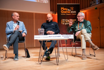Men debating on stage