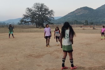 Girls playing in a field