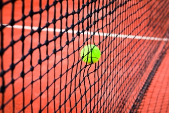 Tennis ball hitting the net. Photo: Colourbox